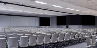 Fenris Creations Hosts Mandatory War Celebration; Employees Remind Attendees That Attendance Is Technically Voluntary Half-empty corporate conference room at EVE Online Fanfest event